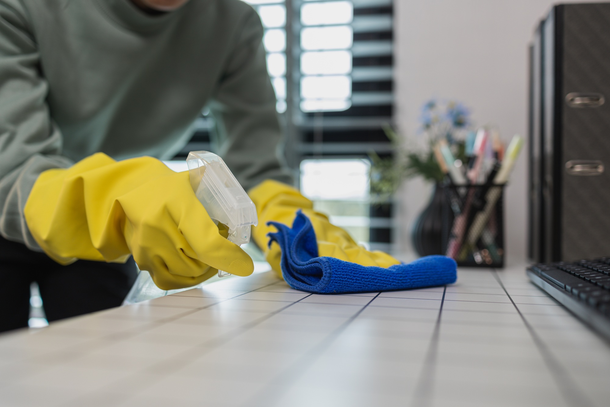 a company's cleaning lady is diligently cleaning the executive's office