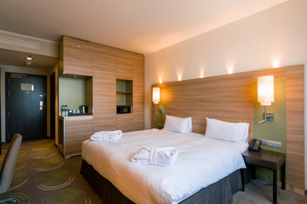 interior of deluxe hotel room after cleaning housekeeping bedroom rest room